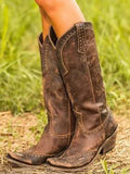 Botas cowgirl vintage con detalles metálicos