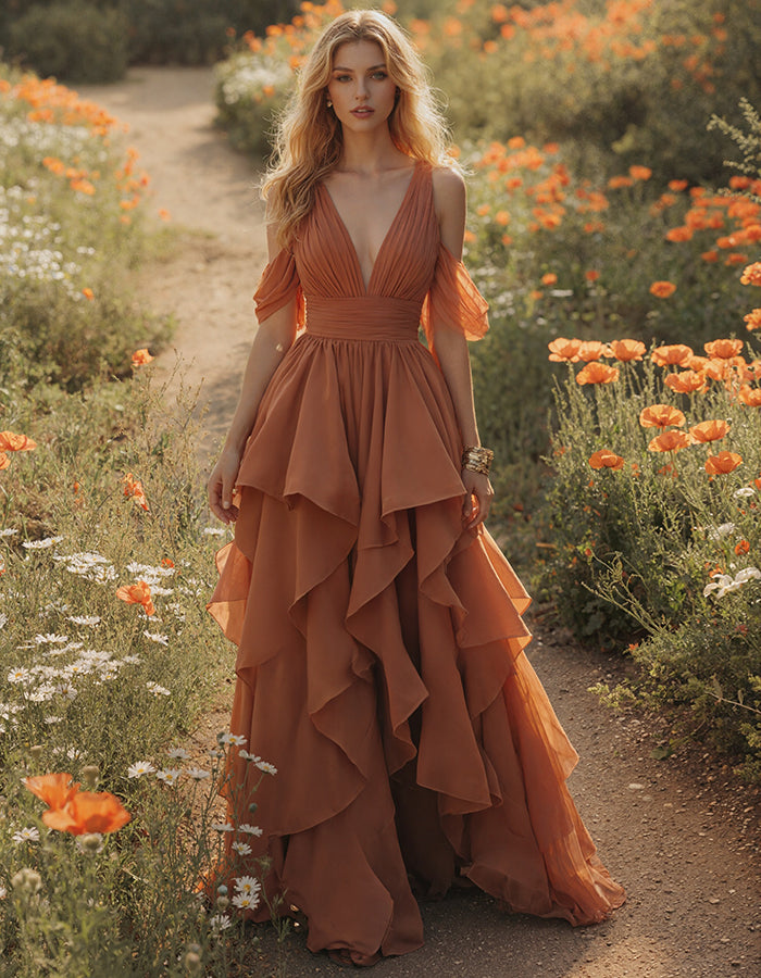 Vestido largo terracota con escote pico y mangas de volantes