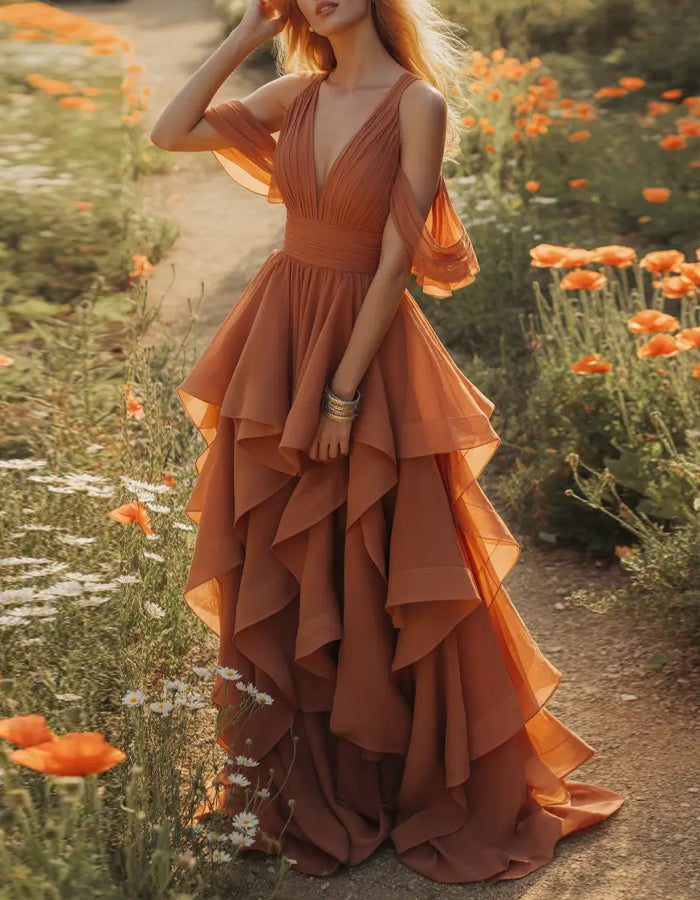 Vestido largo terracota con escote pico y mangas de volantes