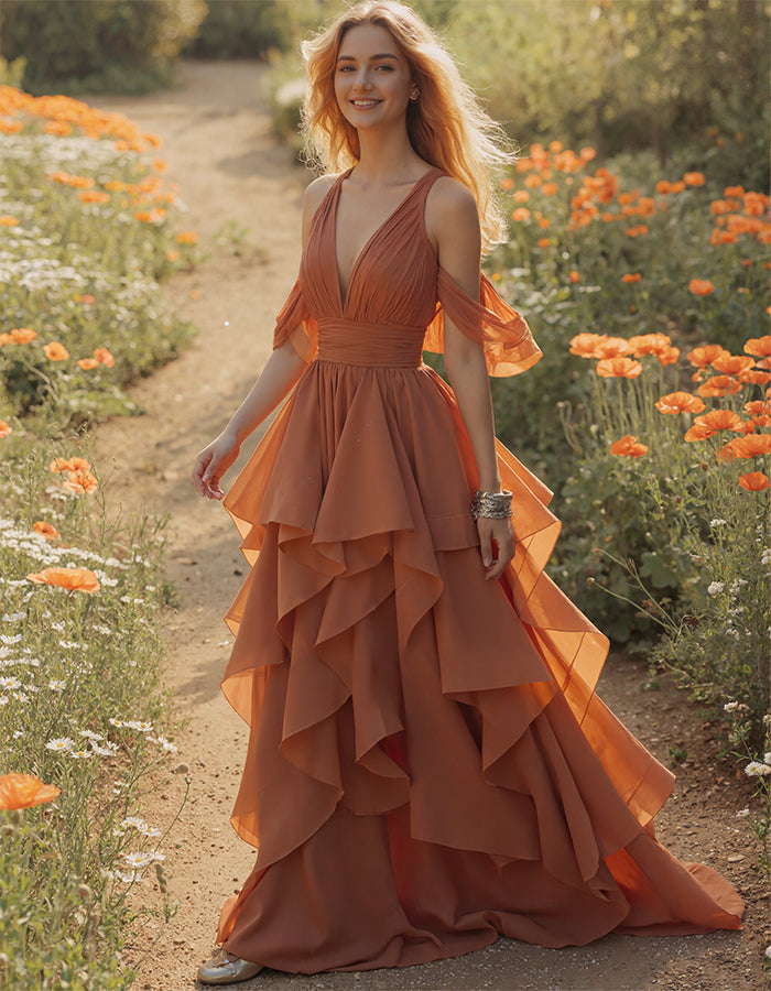 Vestido largo terracota con escote pico y mangas de volantes