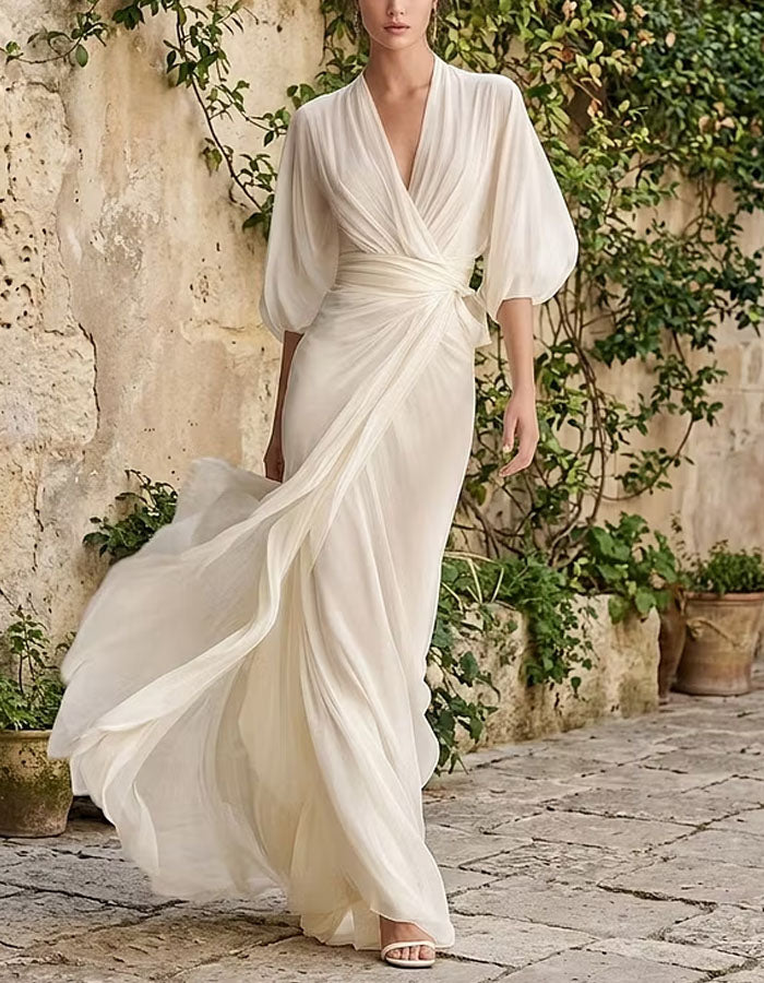 Vestido largo blanco con escote en V y mangas abullonadas