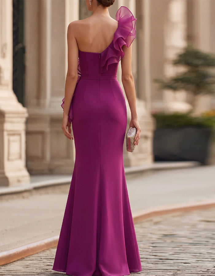 Vestido largo rosa fucsia asimétrico con volantes
