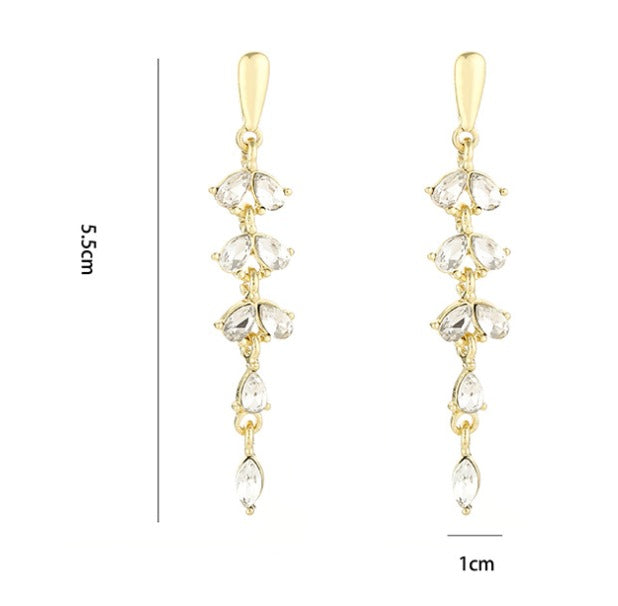 Pendientes hoja dorados con circonitas · Baño de oro 18K