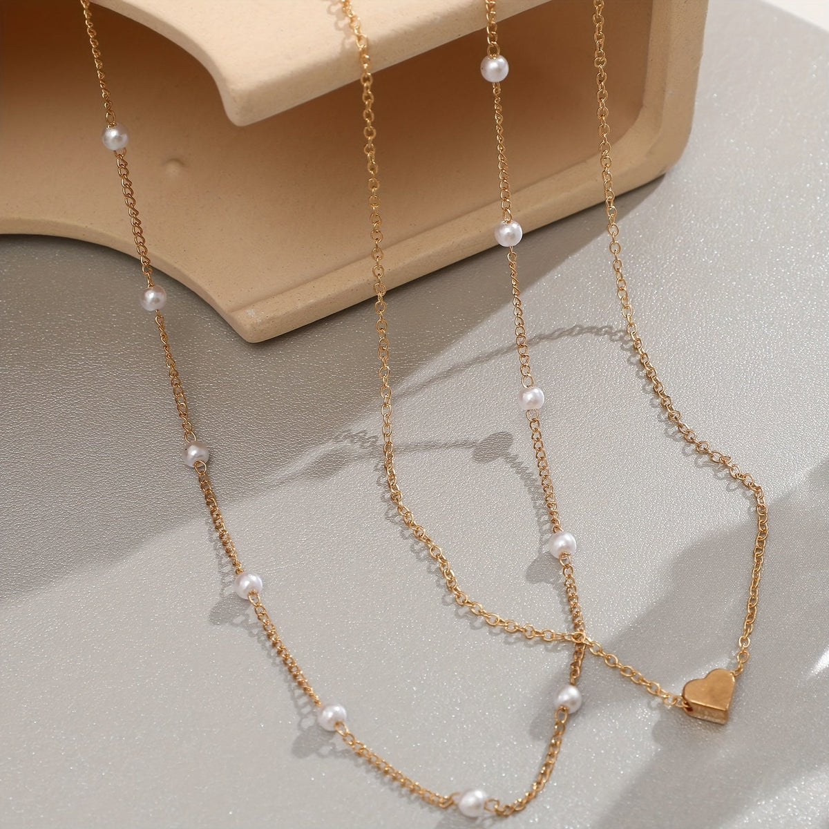 Set corazón y perlas superpuestas Margaux