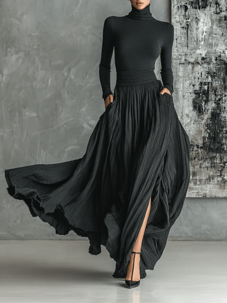Conjunto negro de top de cuello alto y falda plisada
